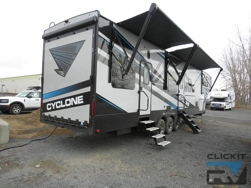 Side view of the RV with an awning.