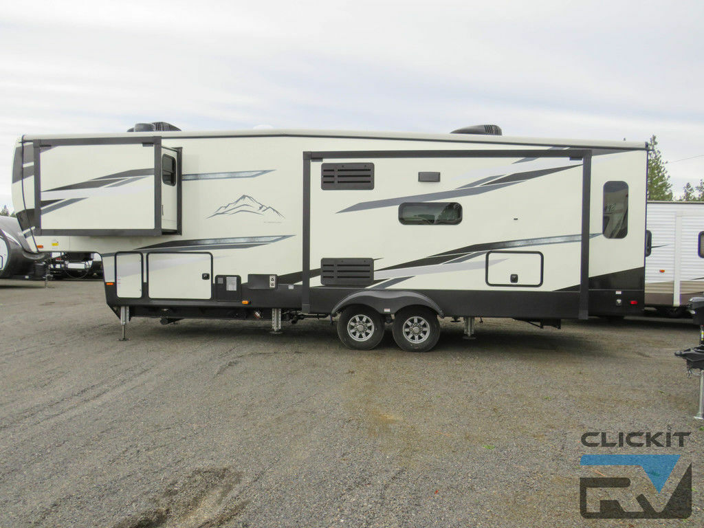 Side view of the New 2022 Heartland Big Country 3155RLK Fifth Wheel RV.