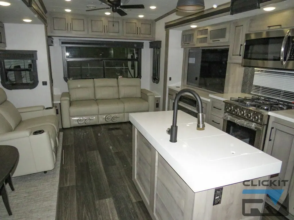 Interior view of the RV with a living space and a kitchen.