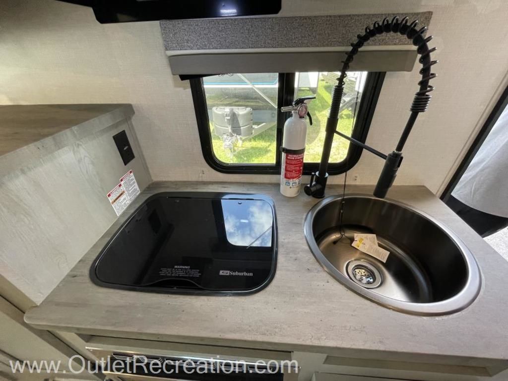 Kitchen with a gas range and a sink.