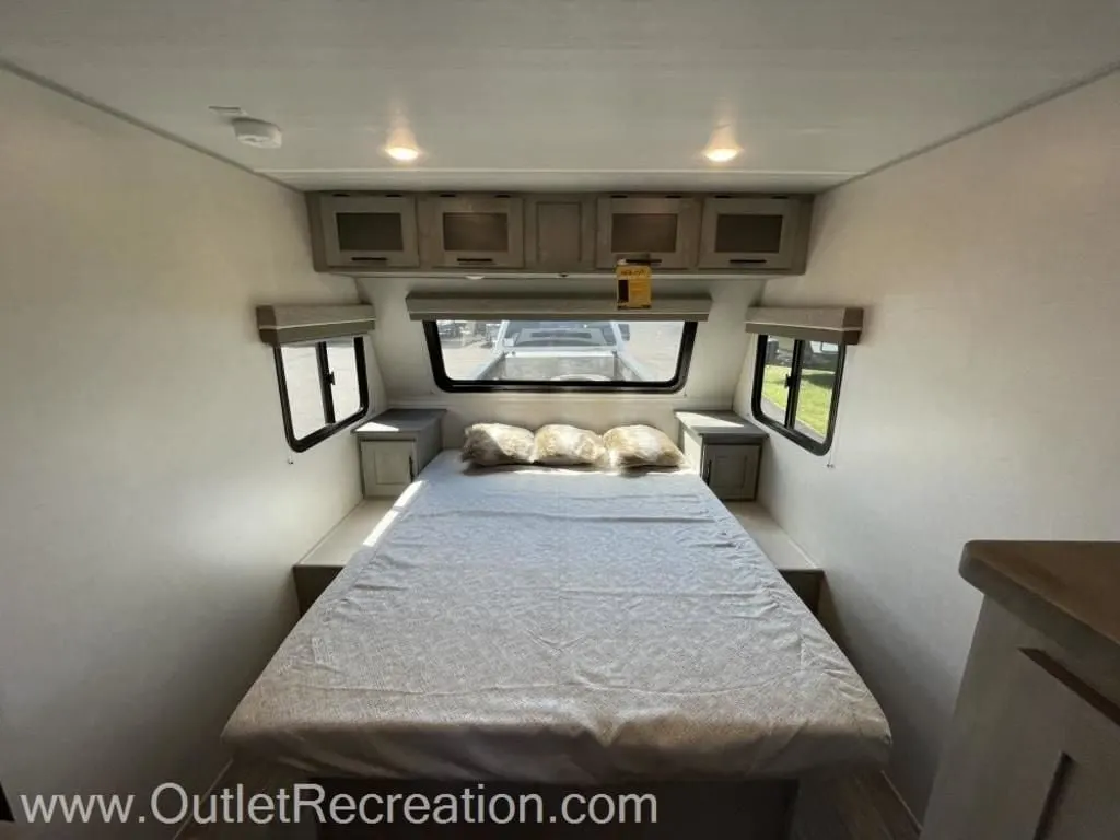 Bedroom with overhead cabinets.