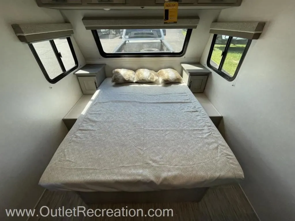 Bedroom with overhead cabinets.