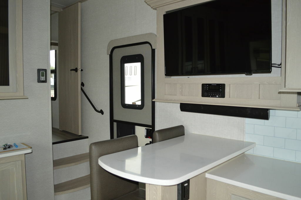 Dinette with a wall-mounted TV.