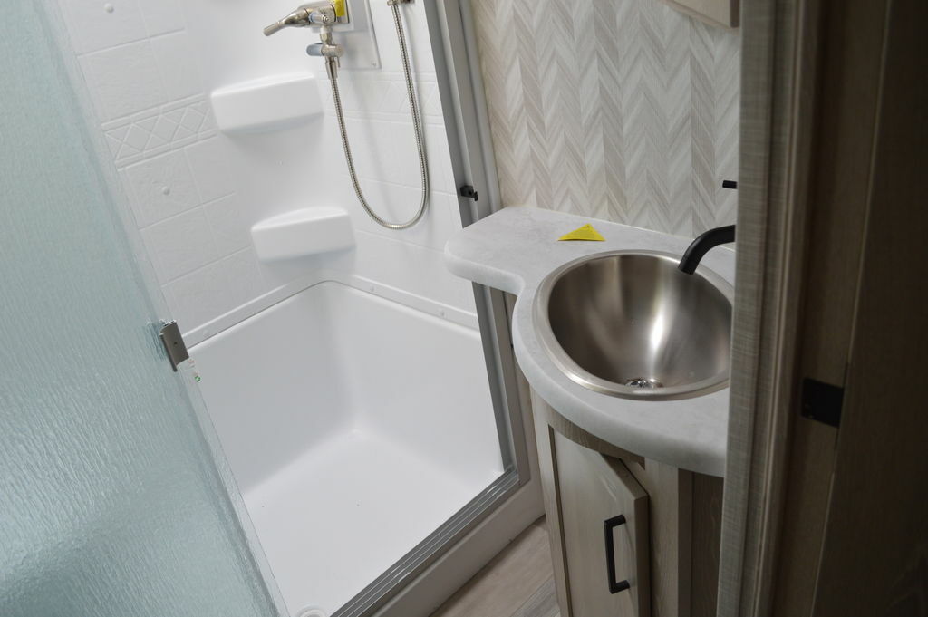 Bathroom with a sink and a walk-in shower.