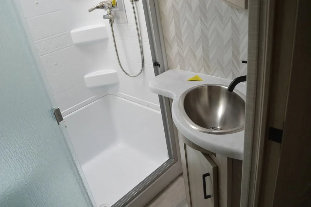 Bathroom with a sink and a walk-in shower.