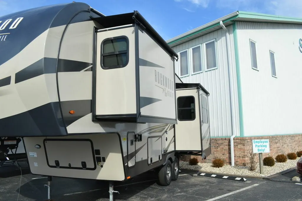 Side view of the RV with slide outs.