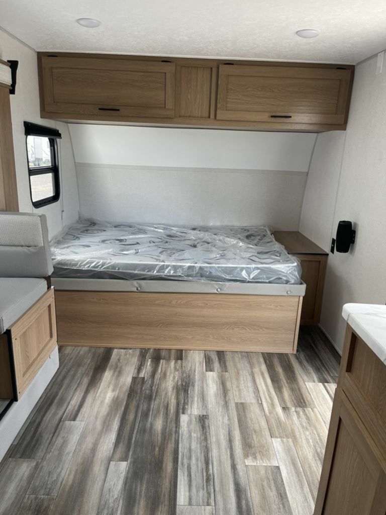 Bedroom with overhead cabinets.