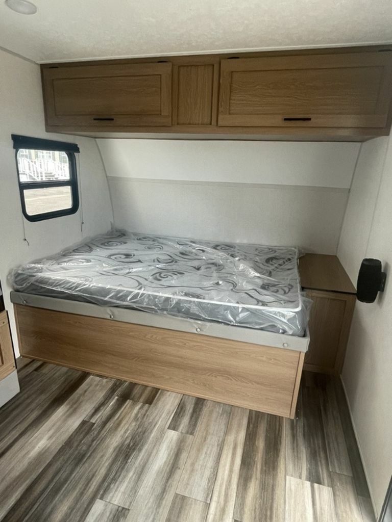 Bedroom with overhead cabinets.