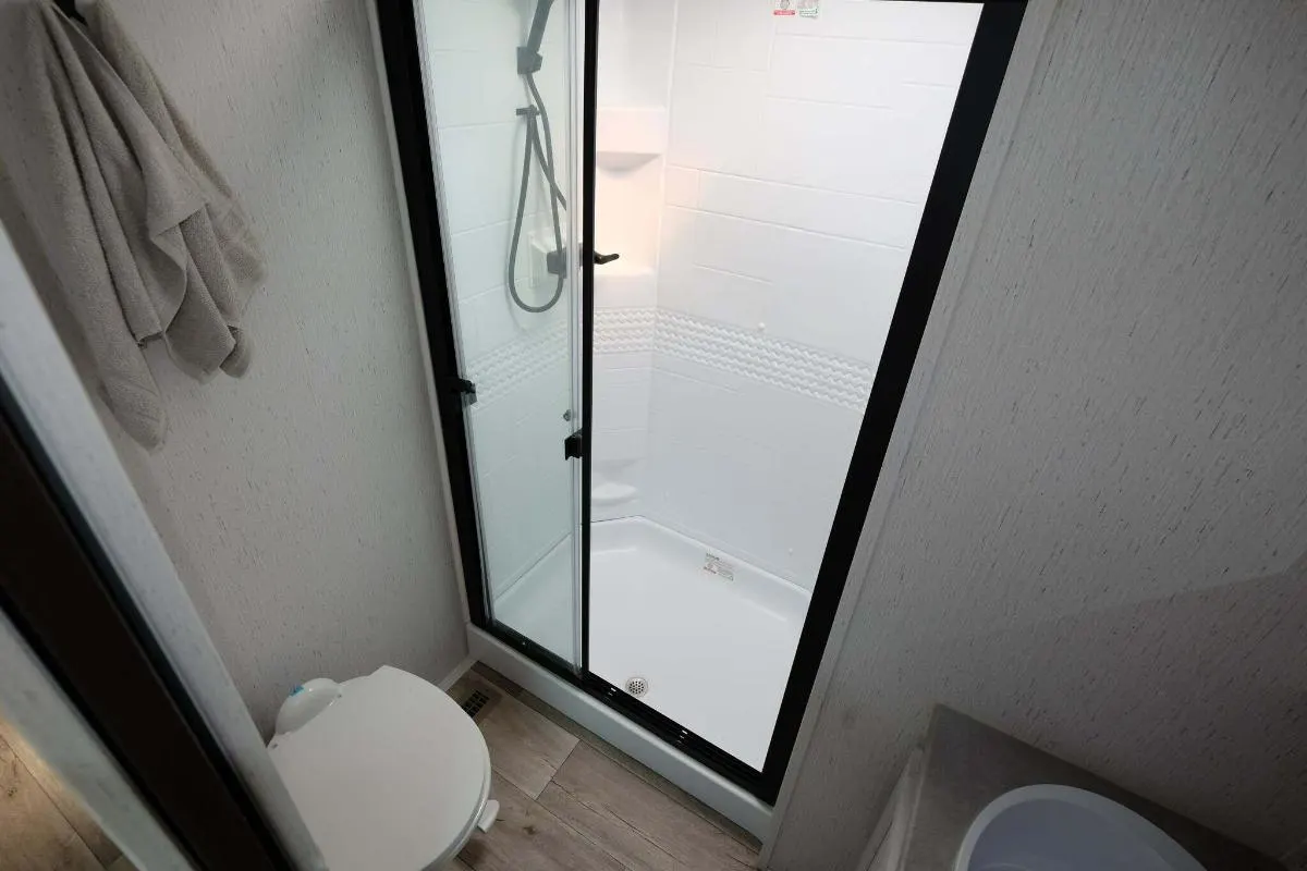 Bathroom with a toilet and a walk-in shower.