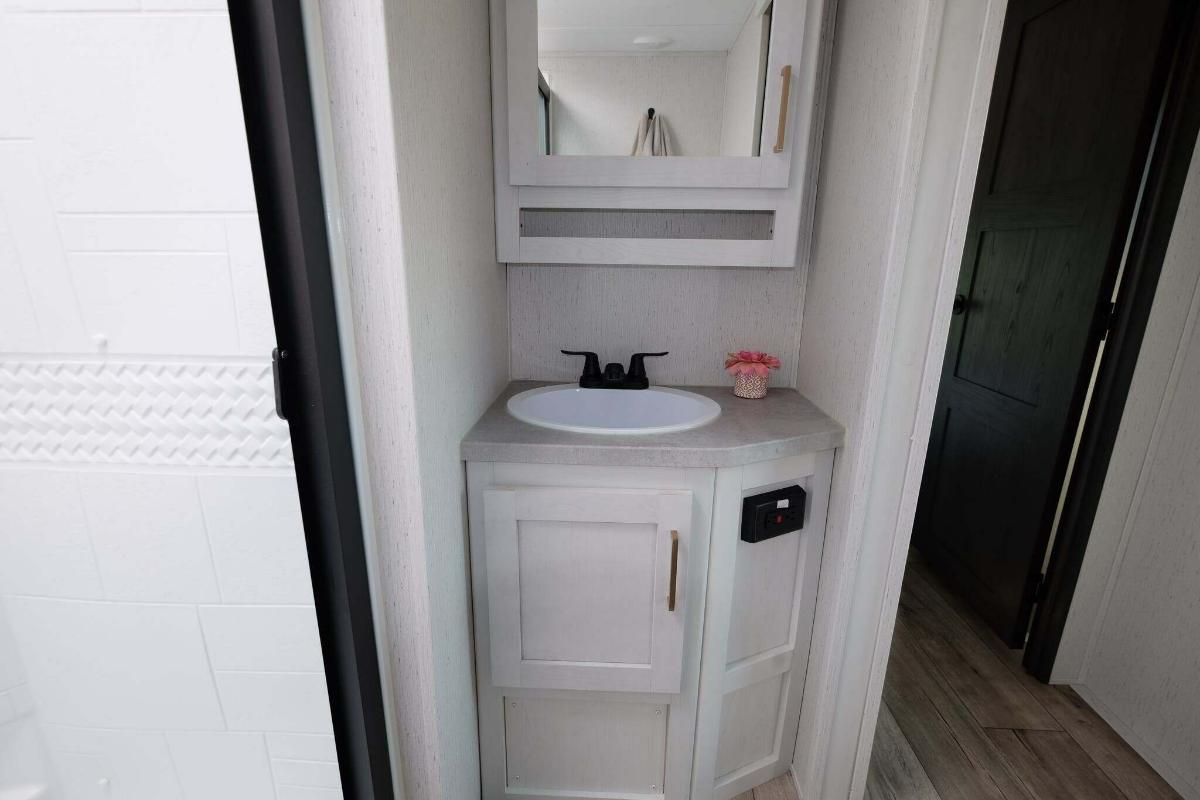 Bathroom sink and a medicine cabinet.