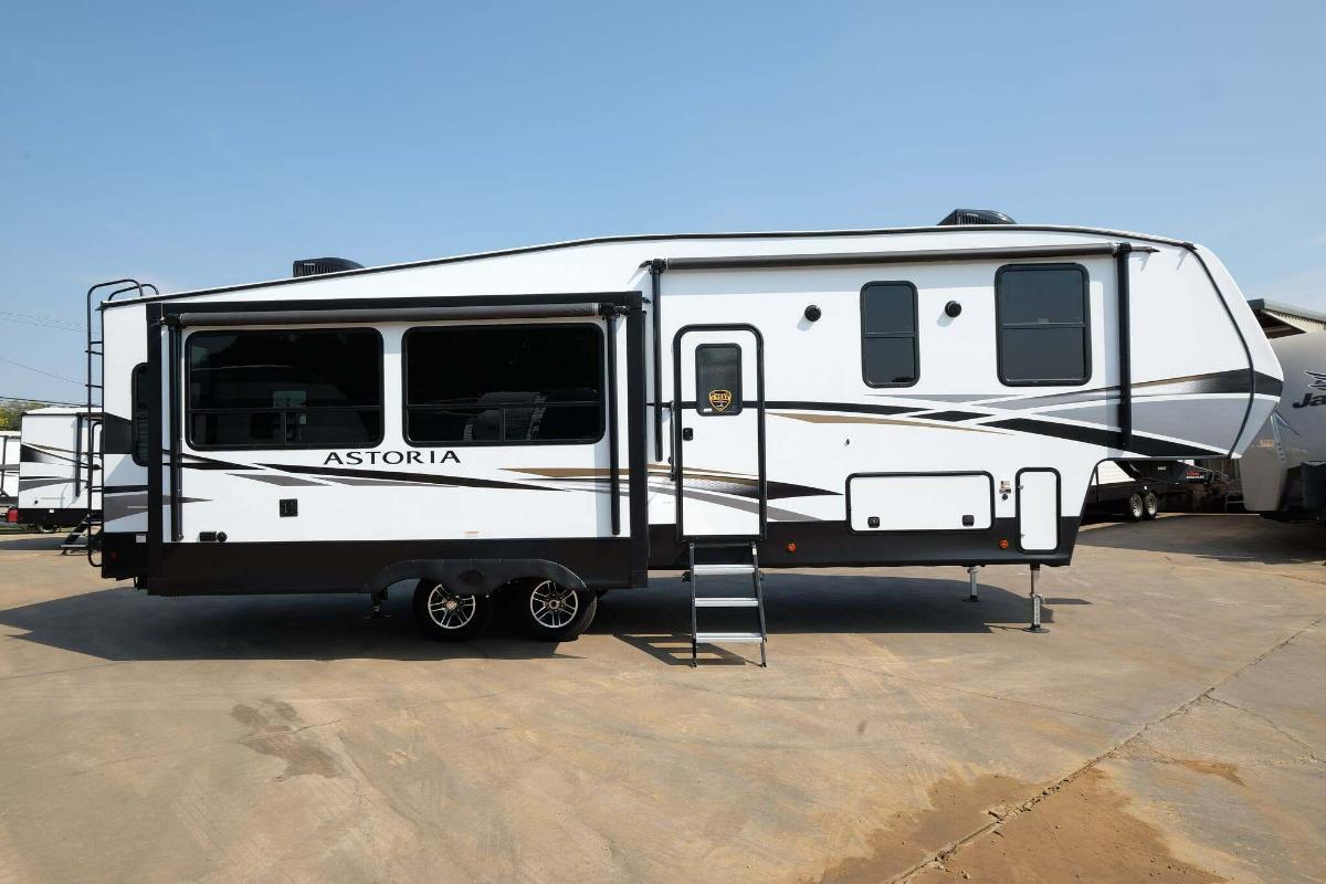 Side view of the New 2022 Dutchmen Astoria 2993RLF Fifth Wheel RV.