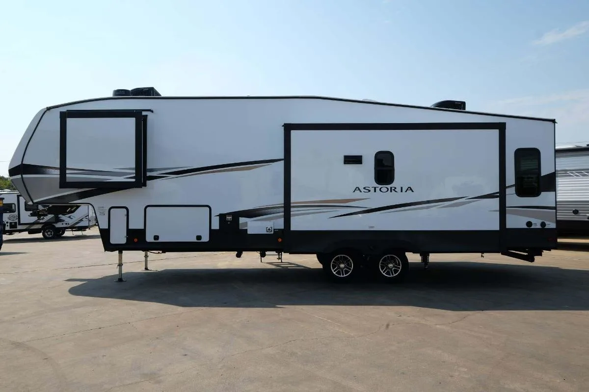 Side view of the New 2022 Dutchmen Astoria 2993RLF Fifth Wheel RV.