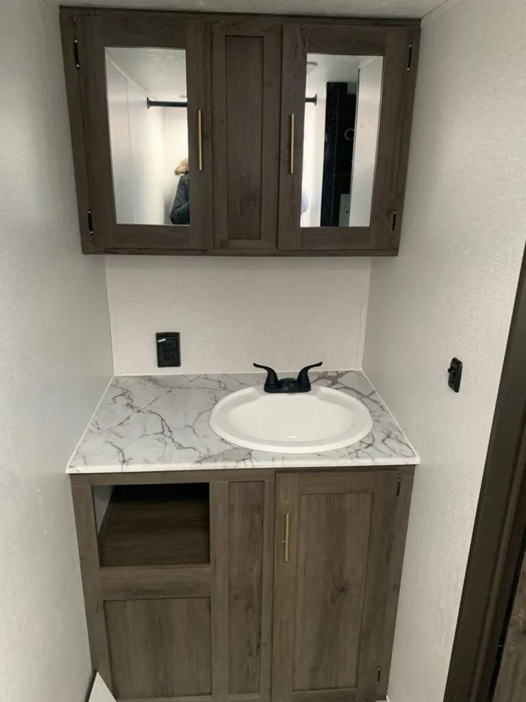 Bathroom sink and medicine cabinet.