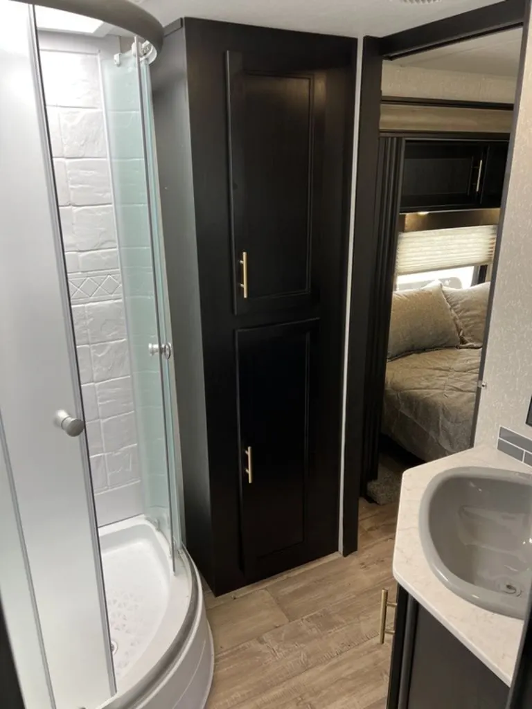 Bathroom with a sink and a walk-in shower.