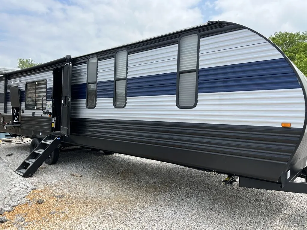 Side view of the New 2022 Forest River Cherokee 304RK Travel Trailer RV.