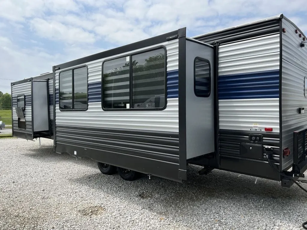 Side view of the New 2022 Forest River Cherokee 304RK Travel Trailer RV.