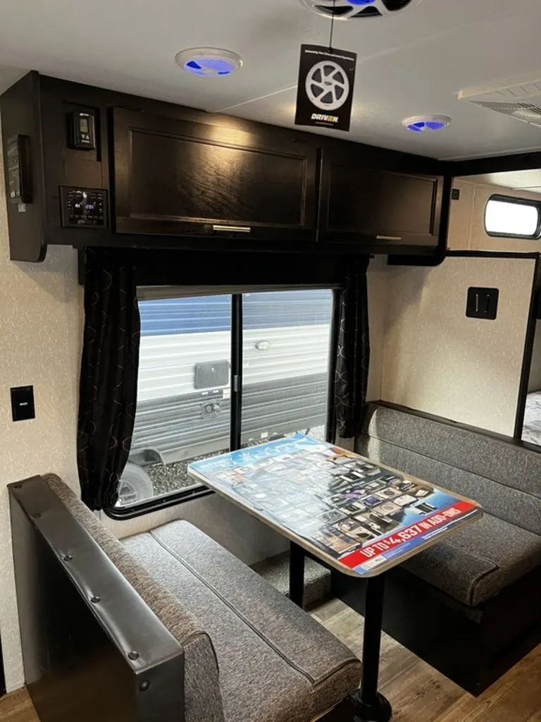 Dinette with overhead cabinets.