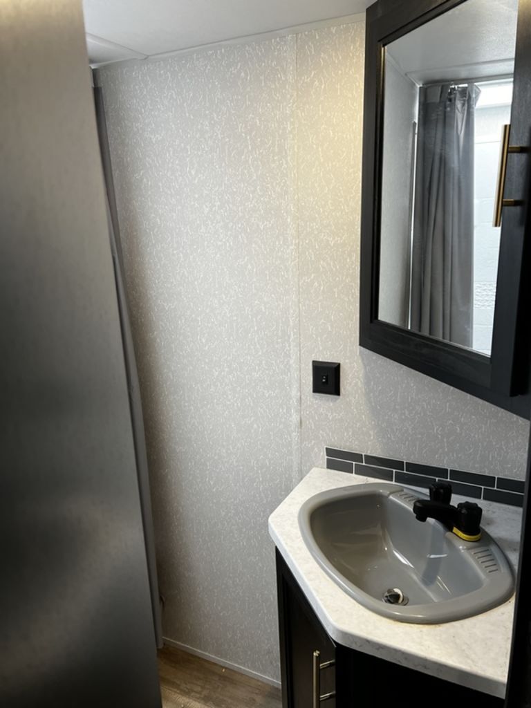 Bathroom sink and a medicine cabinet.