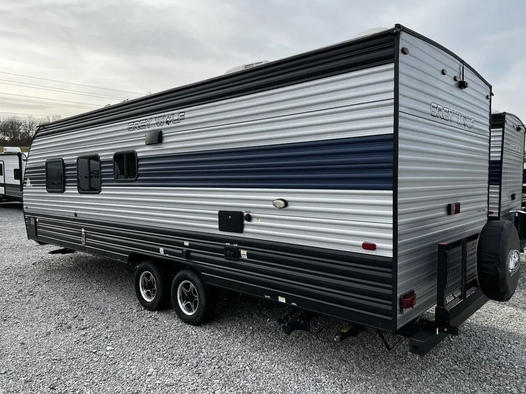 Side view of the New 2022 Forest River Cherokee Grey Wolf 26DJSE Travel Trailer RV.