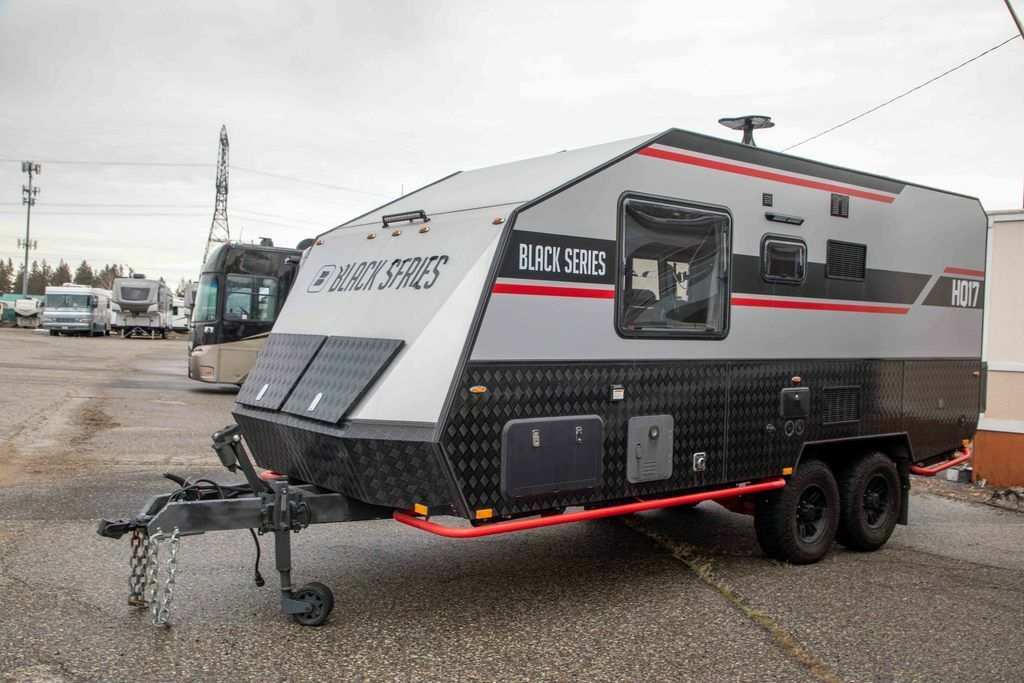 Side view of the New 2022 Black Series Camper Travel Trailers HQ 17 Travel Trailer RV.