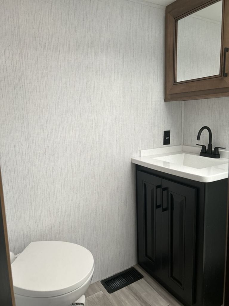 Bathroom with a sink and a toilet.