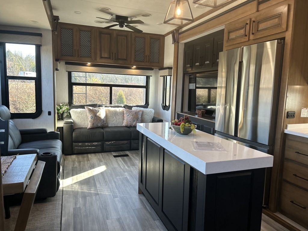 Interior view of the RV with a living space and a kitchen.