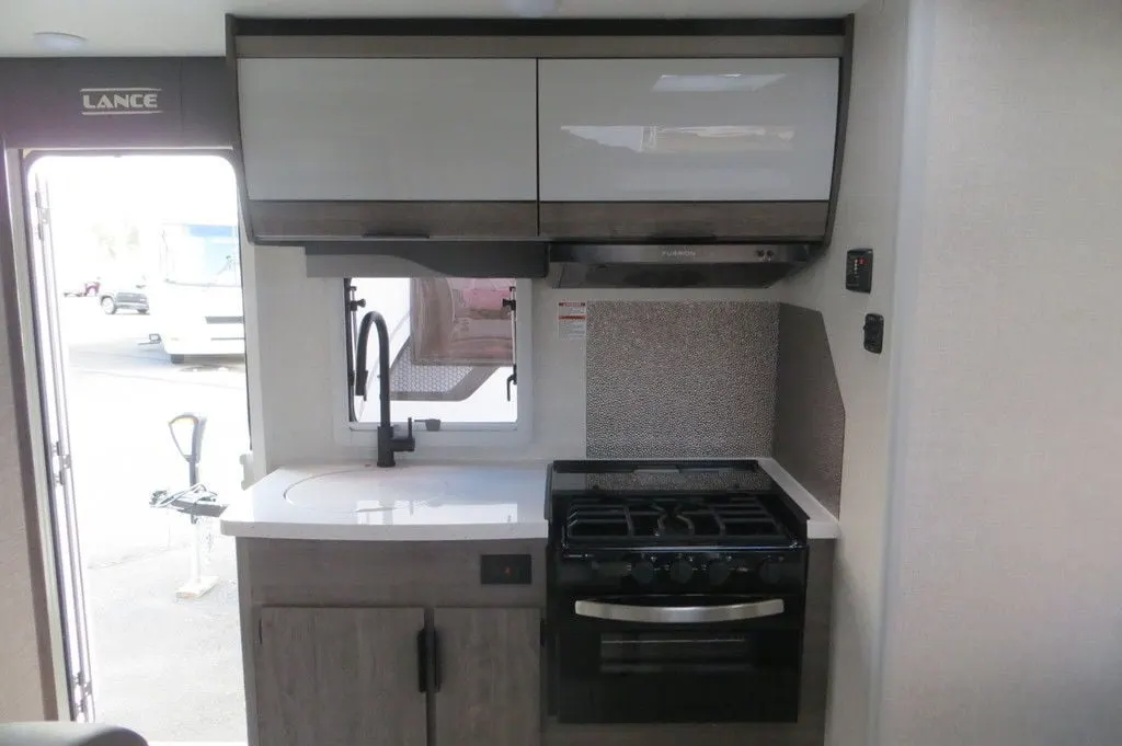 Kitchen with a sink and a gas range.