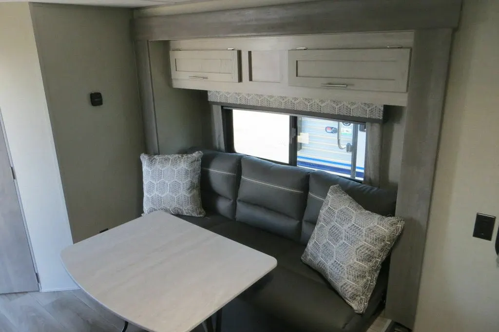 Dinette with overhead cabinets.