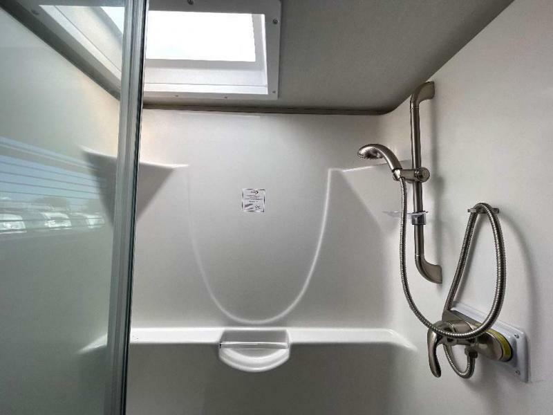 Walk-in shower with skylight.