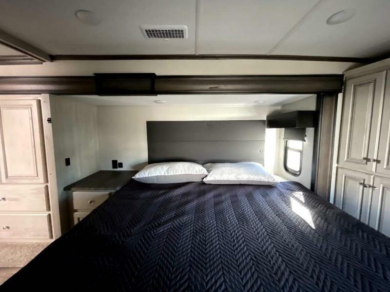 Bedroom with a king size bed and a closet.