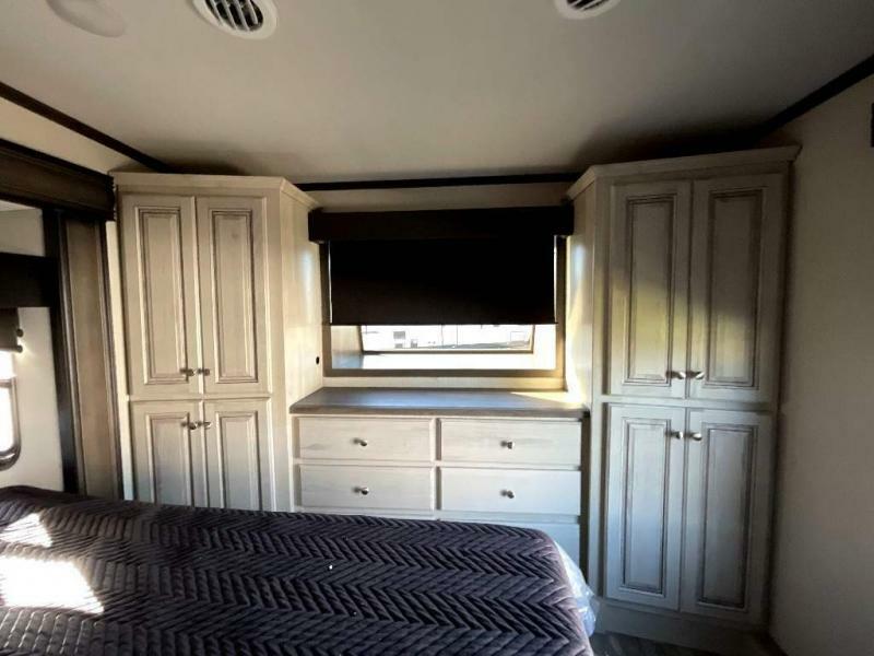 Bedroom with a king size bed and a closet.