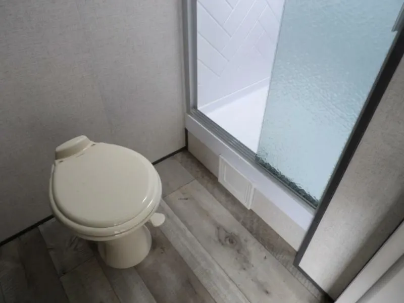 Bathroom with a toilet and a walk-in shower.