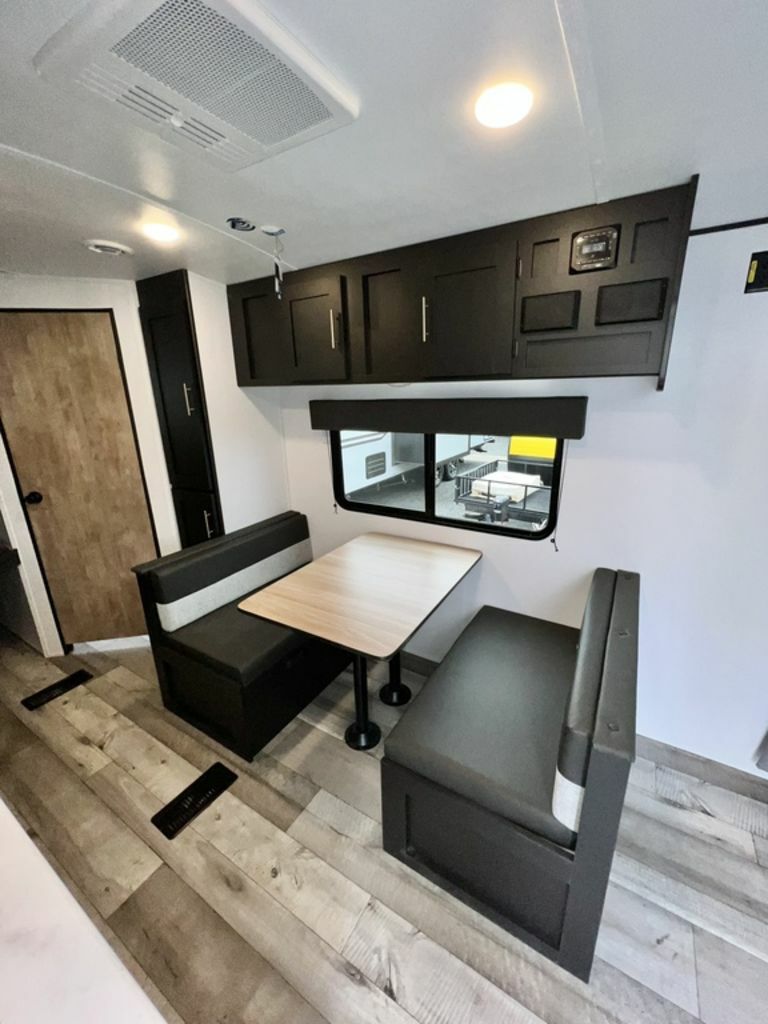 Dinette with overhead cabinets.