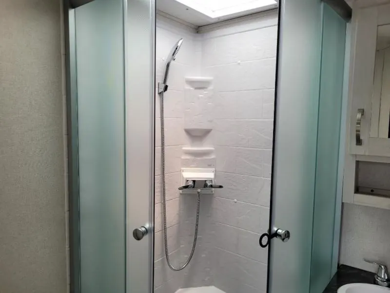 Bathroom with a sink and a walk-in shower.