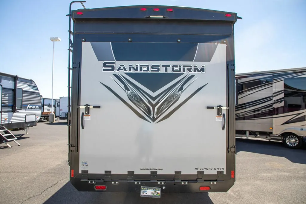 Rear view of the New 2022 Forest River Travel Trailer Sandstorm SLC Series 242GSLC Toy Hauler RV.