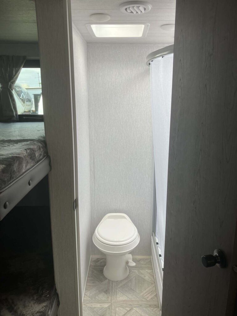 Bathroom with a toilet and a walk-in shower.