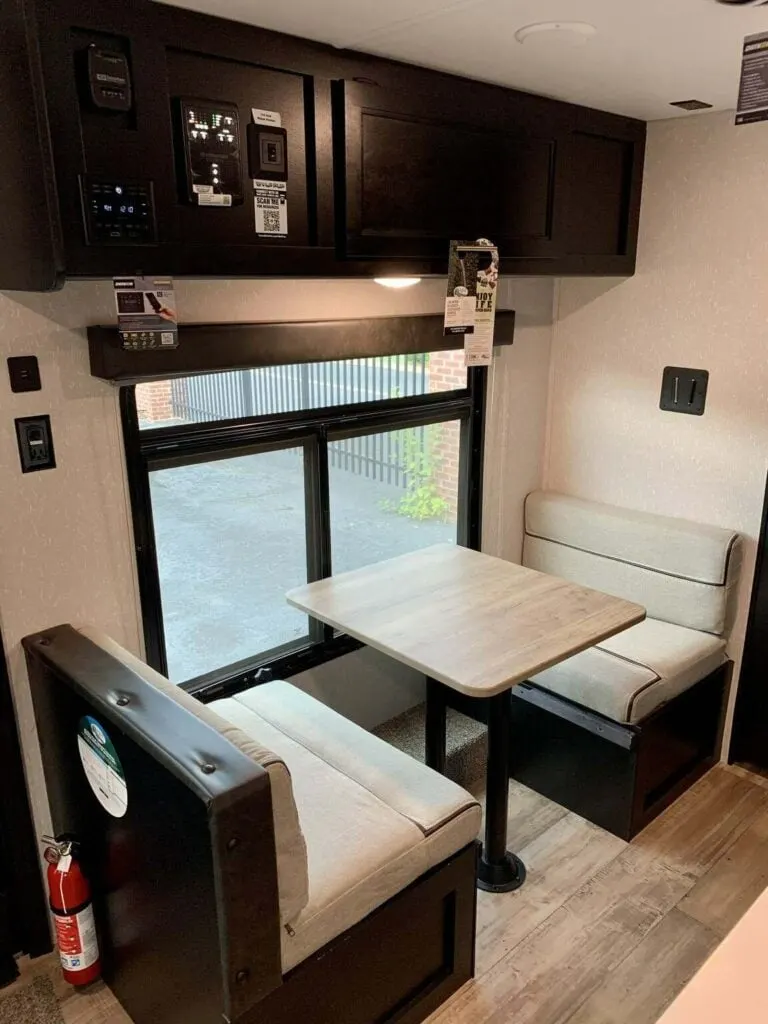 Dinette with overhead cabinets.