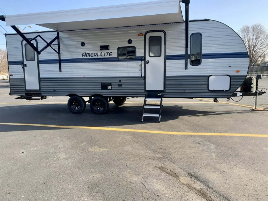 Side view of the New 2022 Gulf Stream Ameri-Lite 268BH Travel Trailer RV.