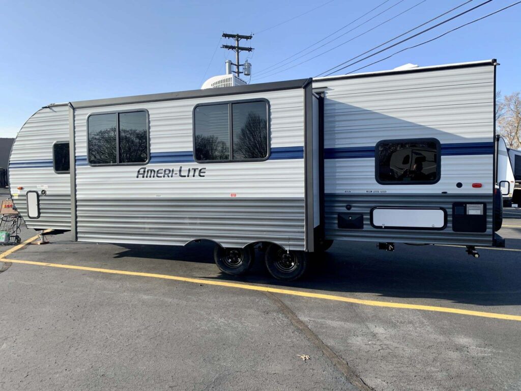 Side view of the New 2022 Gulf Stream Ameri-Lite 268BH Travel Trailer RV.