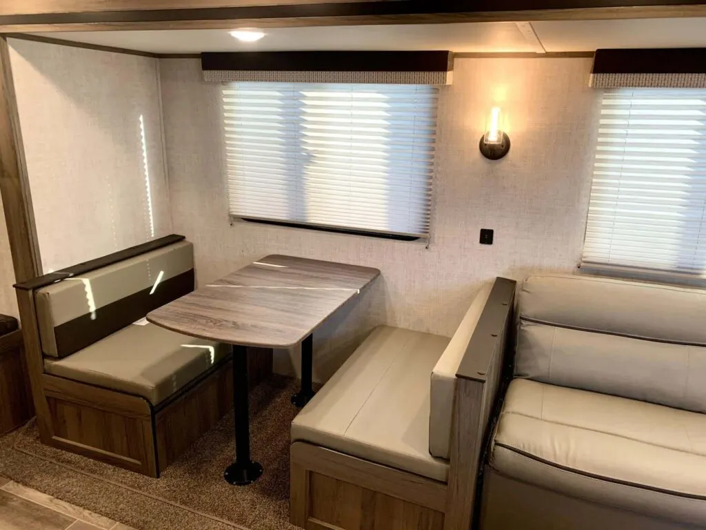 Dinette flanked by leather seats.