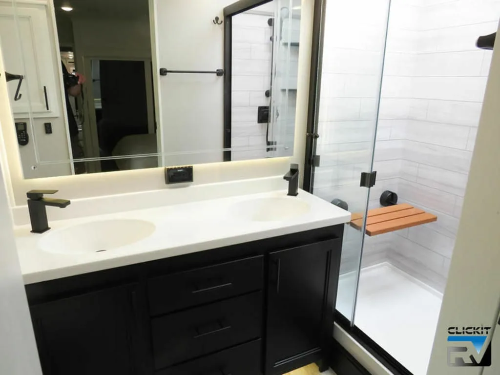 Bathroom with a sink and a walk-in shower.