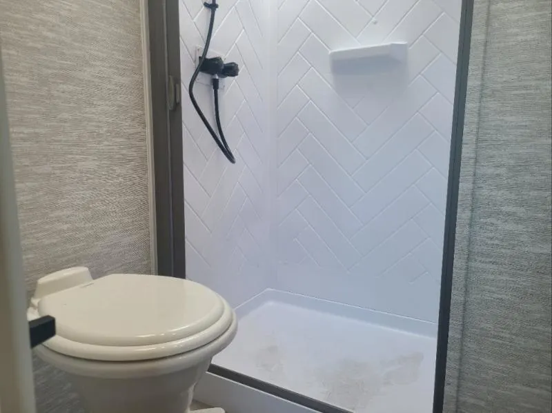 Bathroom with a toilet and a shower.