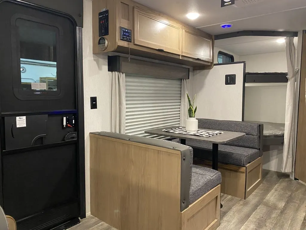 Dinette with overhead cabinets.