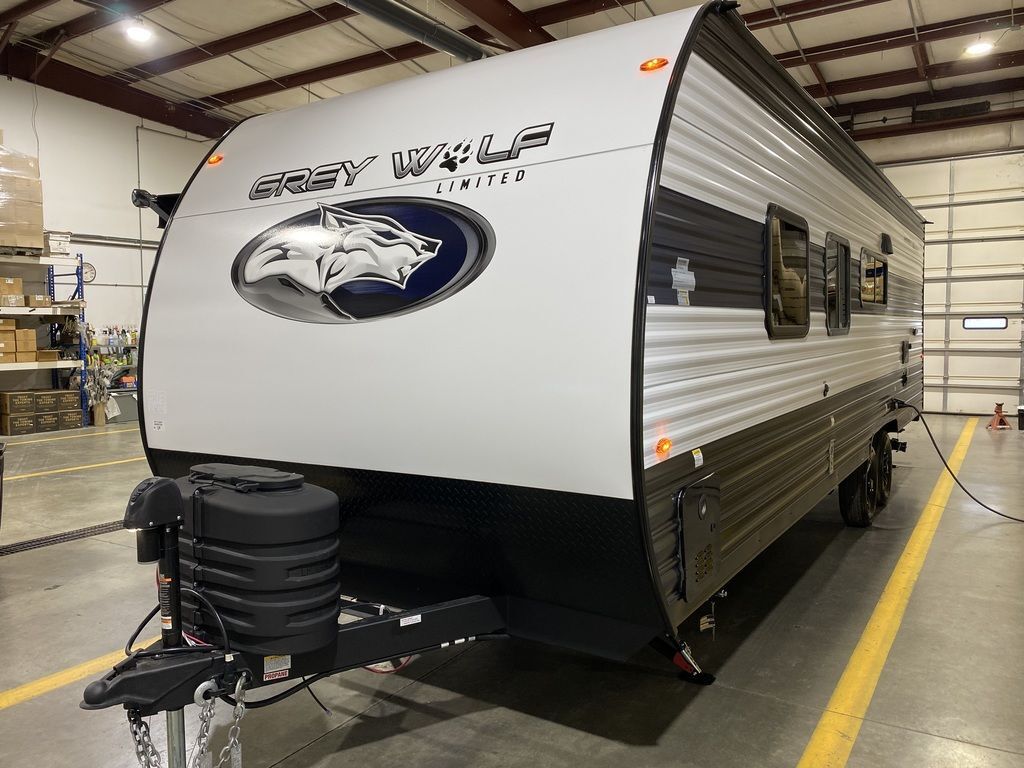 Side view of the New 2024 Forest River Cherokee Grey Wolf 26DJSE Travel Trailer RV.