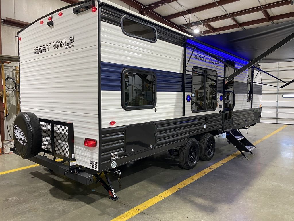 Side view of the New 2024 Forest River Cherokee Grey Wolf 26DJSE Travel Trailer RV.