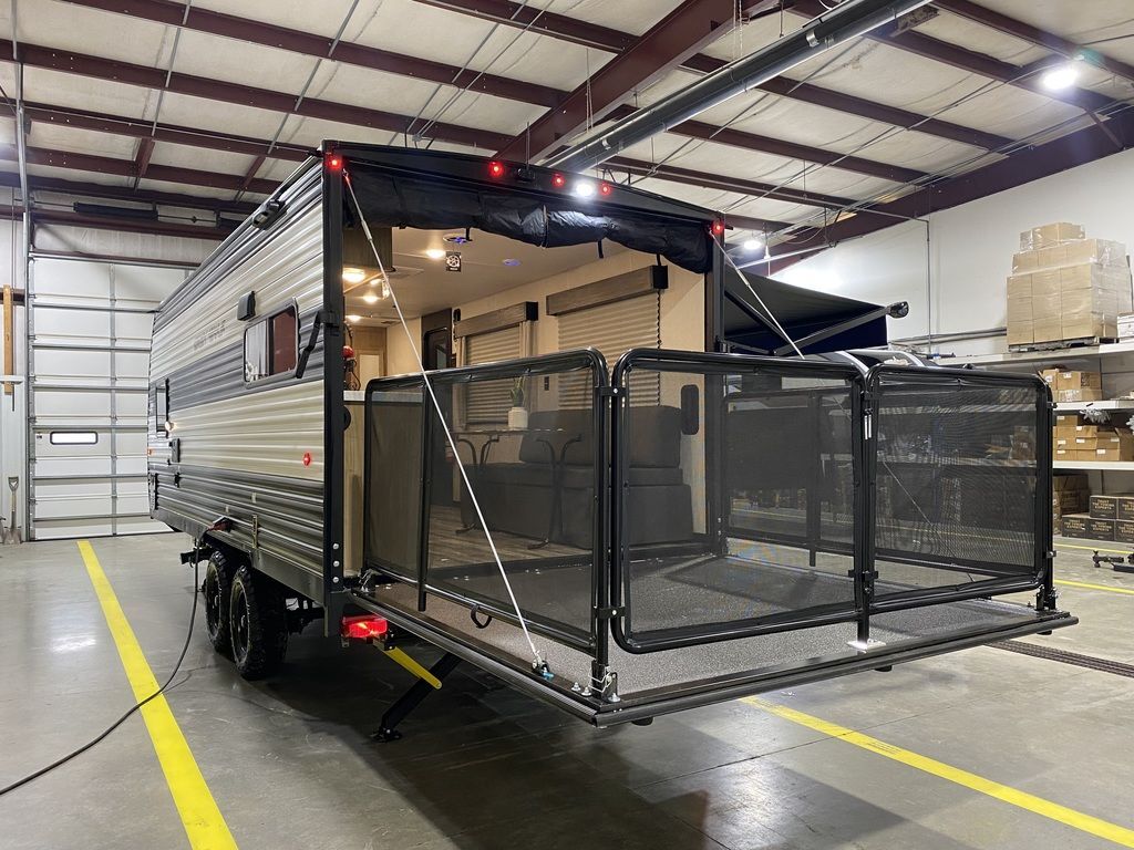 Rear view of the New 2024 Forest River Cherokee Grey Wolf 18RR Travel Trailer Toy Hauler RV.