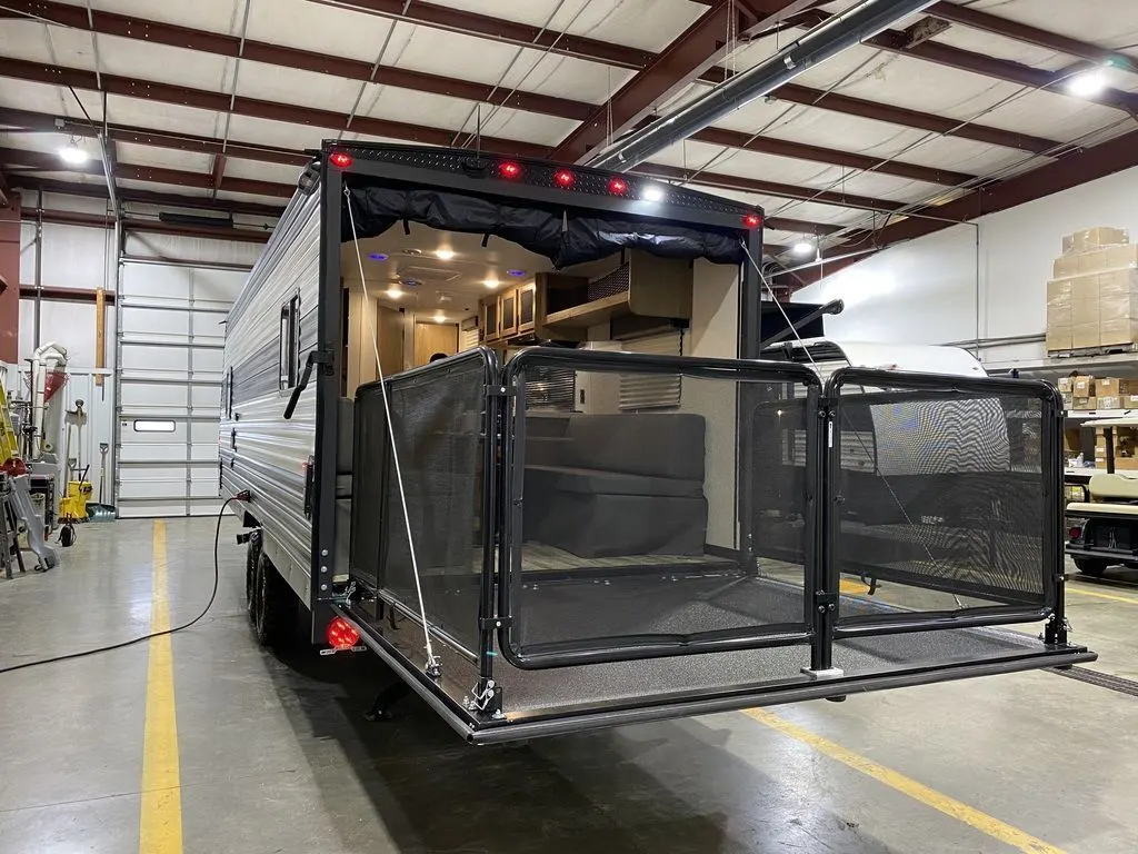 Rear view of the New 2024 Forest River Cherokee Grey Wolf 22RR Travel Trailer Toy Hauler RV.