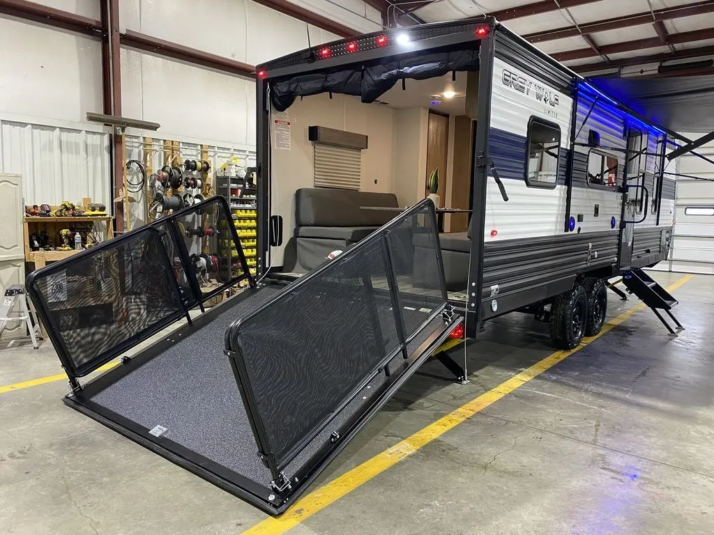 Side view of the New 2024 Forest River Cherokee Grey Wolf 22RR Travel Trailer Toy Hauler RV.