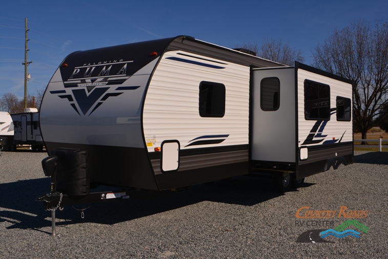 Side view of the New 2024 Palomino Puma 28DBFQ Travel Trailer RV.