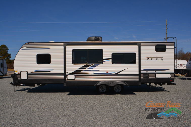 Side view of the New 2024 Palomino Puma 28DBFQ Travel Trailer RV.